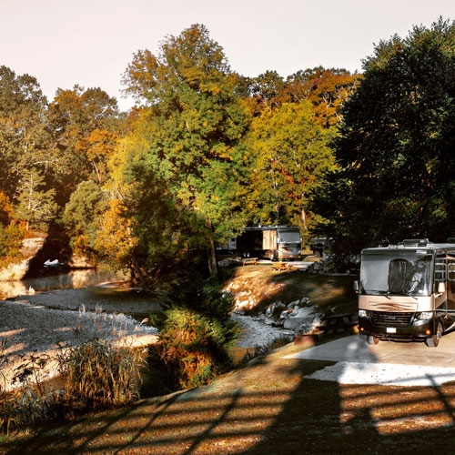 3 Tips for the Best Camping Experience in Nashville 2 RV parked in a RV campground near a river in Nashville TN