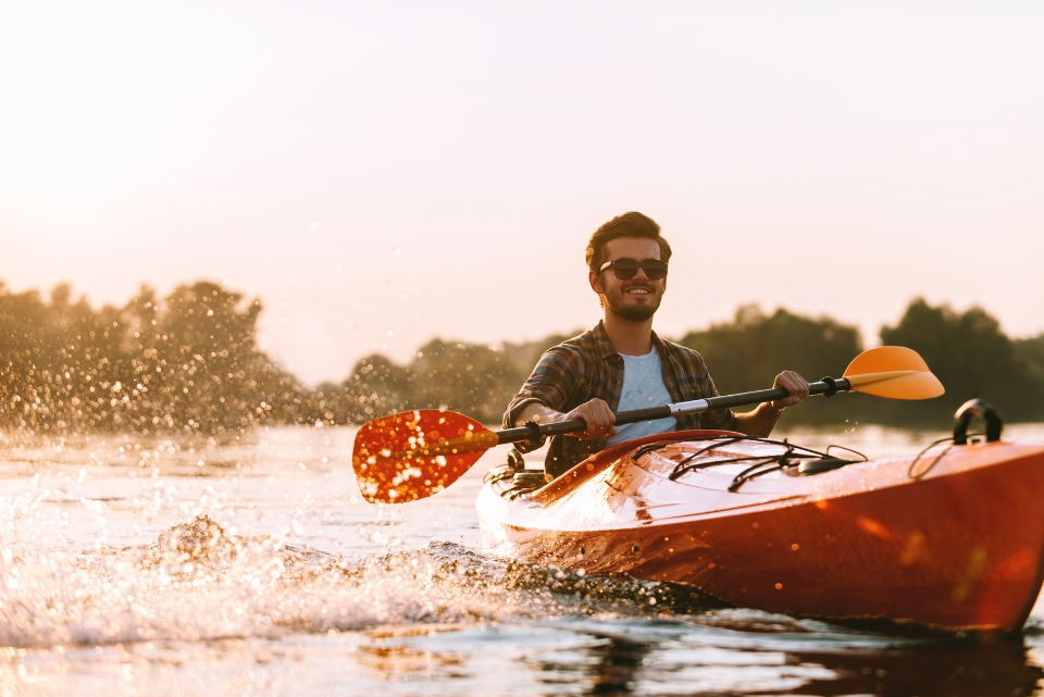 person kayaking on a river