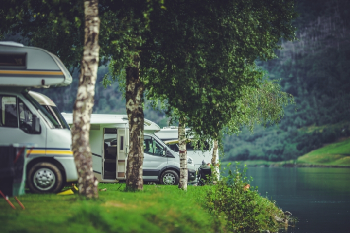 rv's parked near a lake