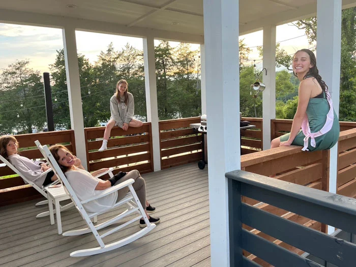 group of people on a tiny house porch