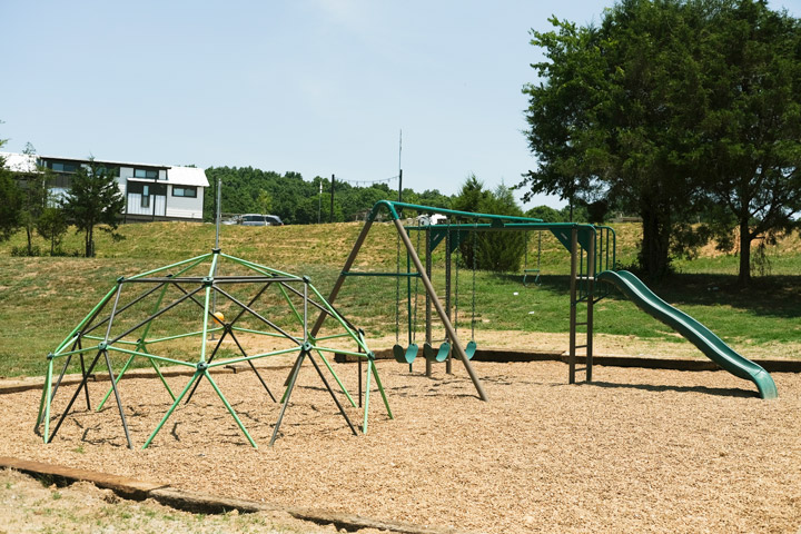 playground with a slide and dome structure